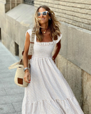 Women’s evening dress with ruffle accents and checkered sleeves