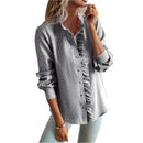 Women's blouse with ruffle accents and clean button front