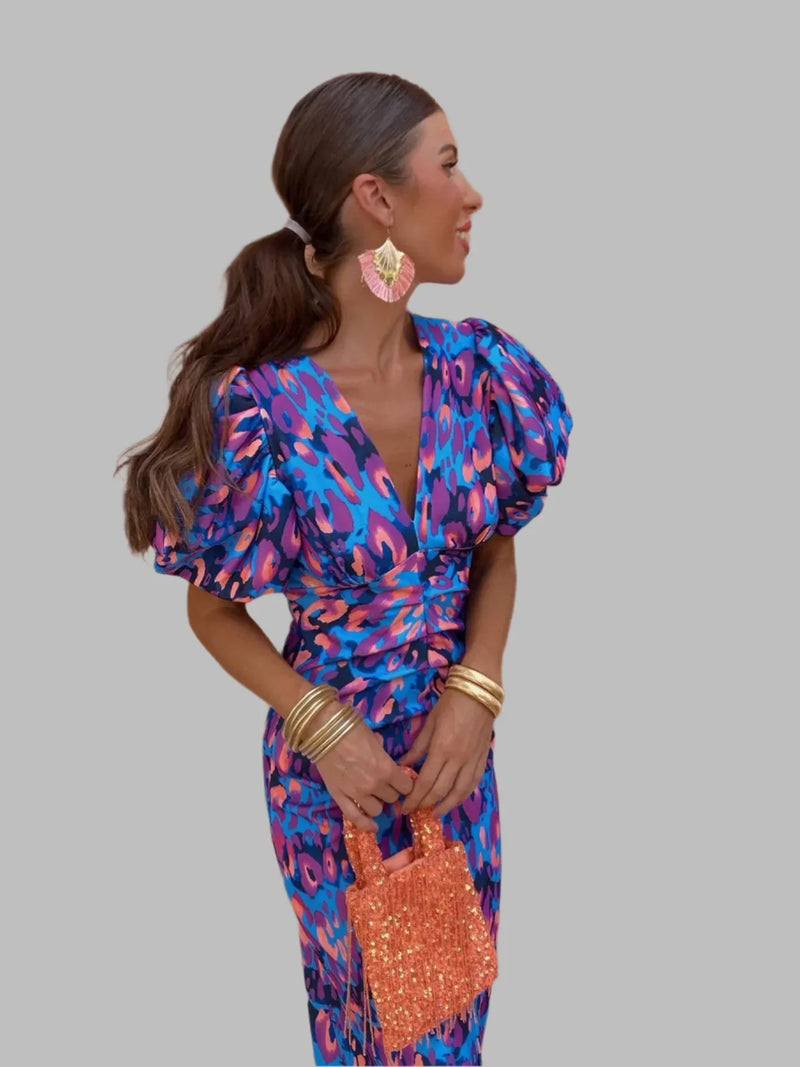 Women's dress with pleated sleeves and defined waist