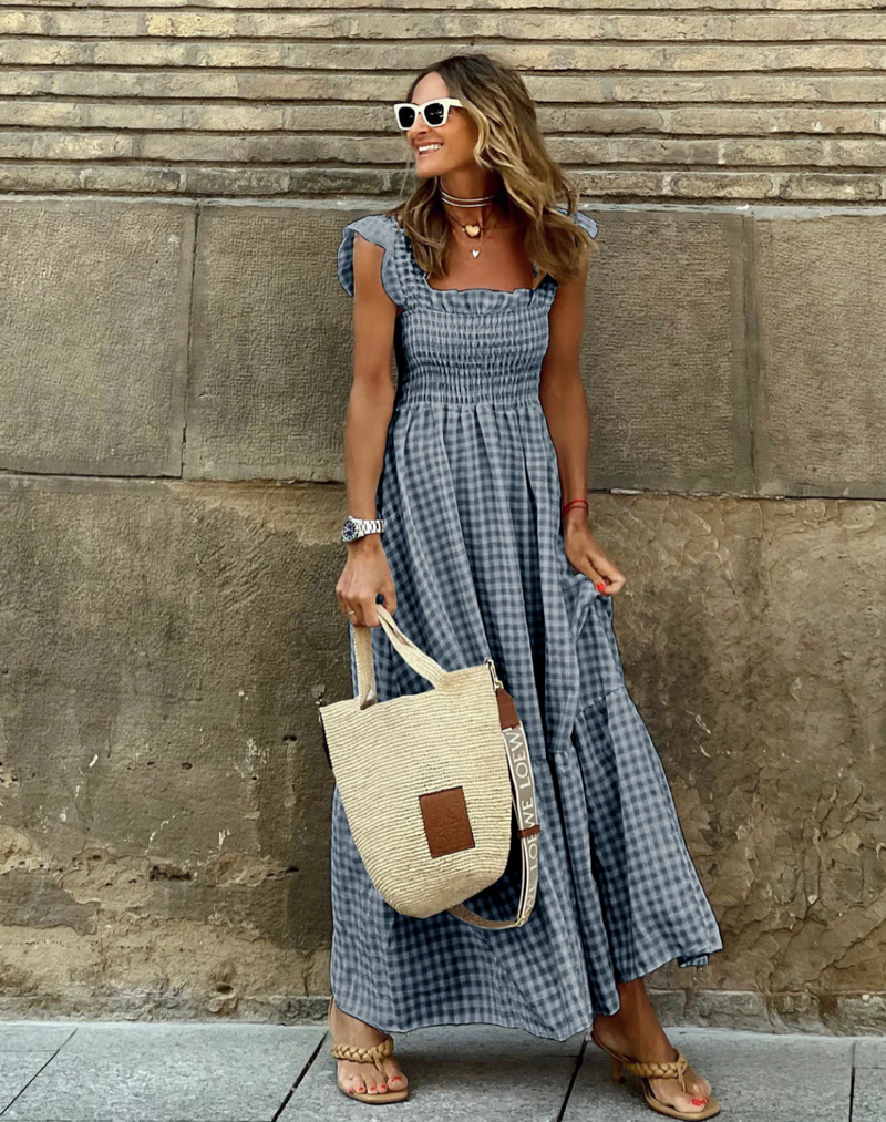 Women’s evening dress with ruffle accents and checkered sleeves