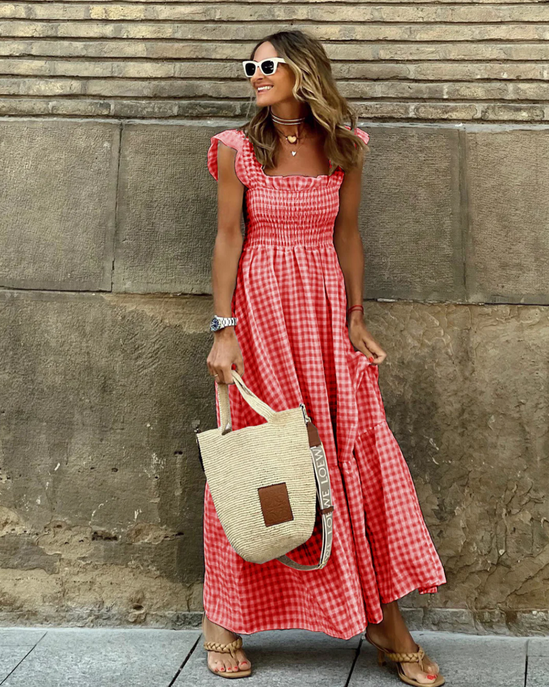 Women’s evening dress with ruffle accents and checkered sleeves