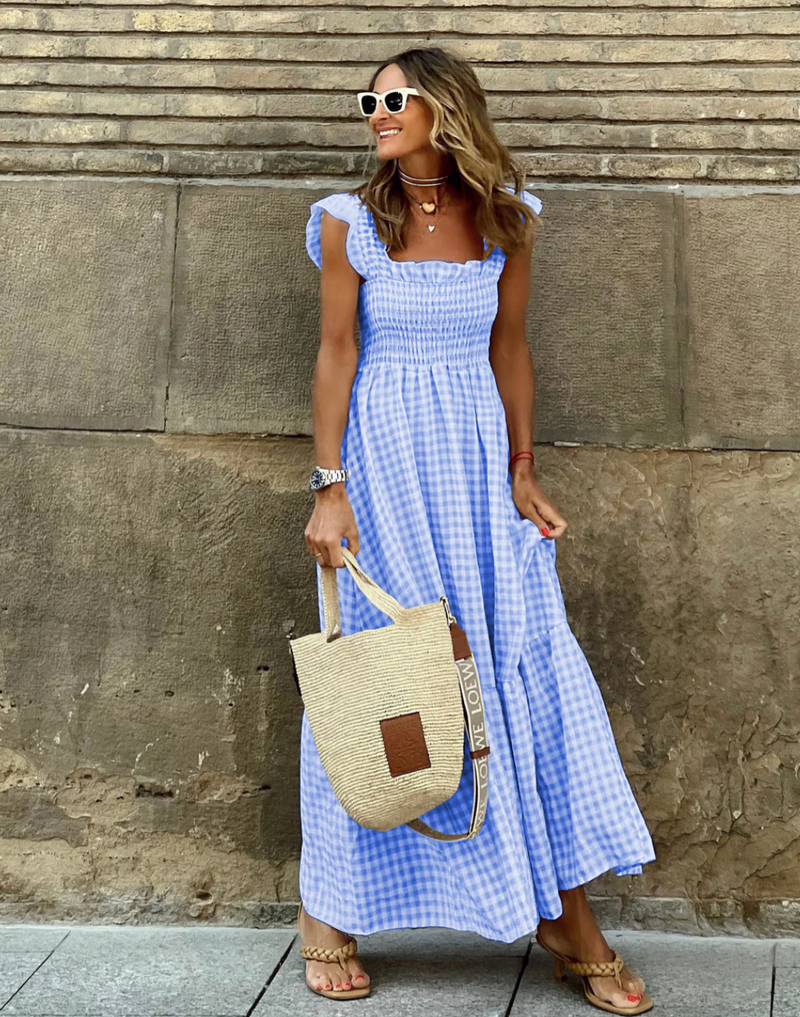 Women’s evening dress with ruffle accents and checkered sleeves