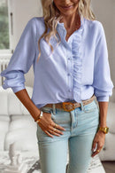Women's blouse with ruffle accents and clean button front