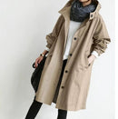 Women’s trench coat with structured cut and functional design