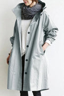 Women’s trench coat with structured cut and functional design