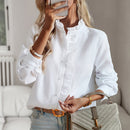 Women's blouse with ruffle accents and clean button front