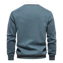 Men's long-sleeve polo with contrast collar and structured shape