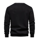 Men's long-sleeve polo with contrast collar and structured shape