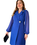 Women’s dress with sheer sleeves and defined silhouette