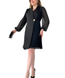 Women’s dress with sheer sleeves and defined silhouette