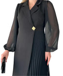 Women’s dress with sheer sleeves and defined silhouette