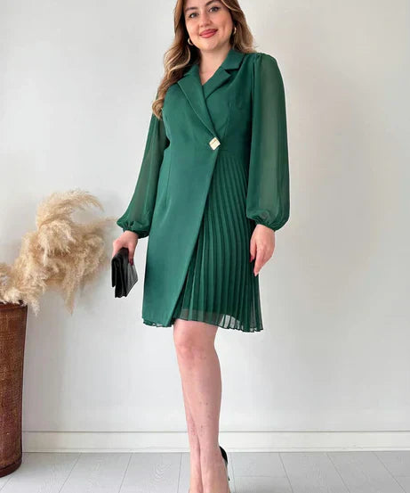 Women’s dress with sheer sleeves and defined silhouette