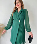 Women’s dress with sheer sleeves and defined silhouette